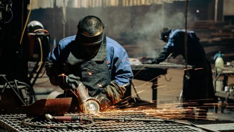 Workers are cutting steel