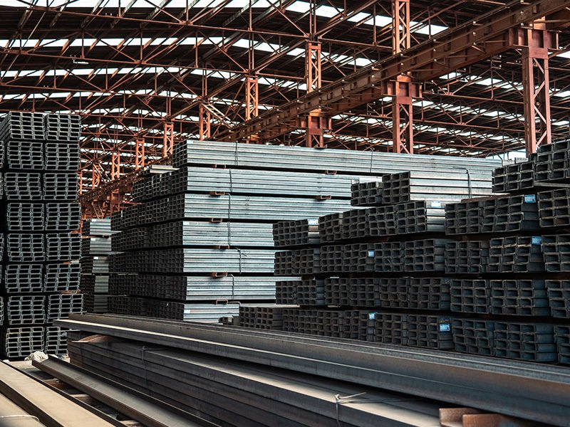 Steel pipes are stacked in factory warehouses